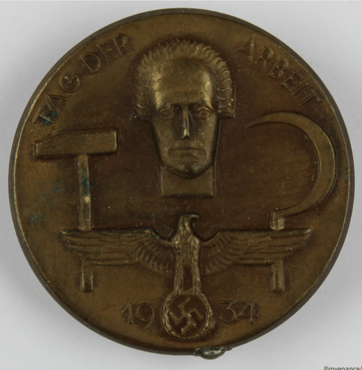 Museum Wolmirstedt. (2018-05-16). Abzeichen zum 1. Mai 1934. Retrieved from https://st.museum-digital.de/index.php?t=objekt&oges=43084